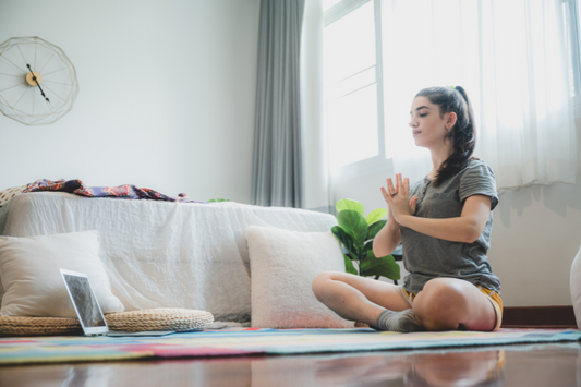 Girl doing yoga in bedroom. 10 ways to help tweens relax