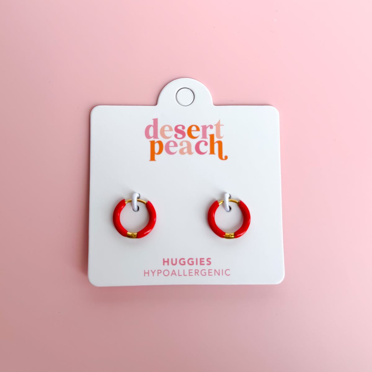 Red huggie hoop earrings