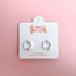 White huggie hoop earrings