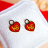 KC heart huggie charms on huggie hoops
