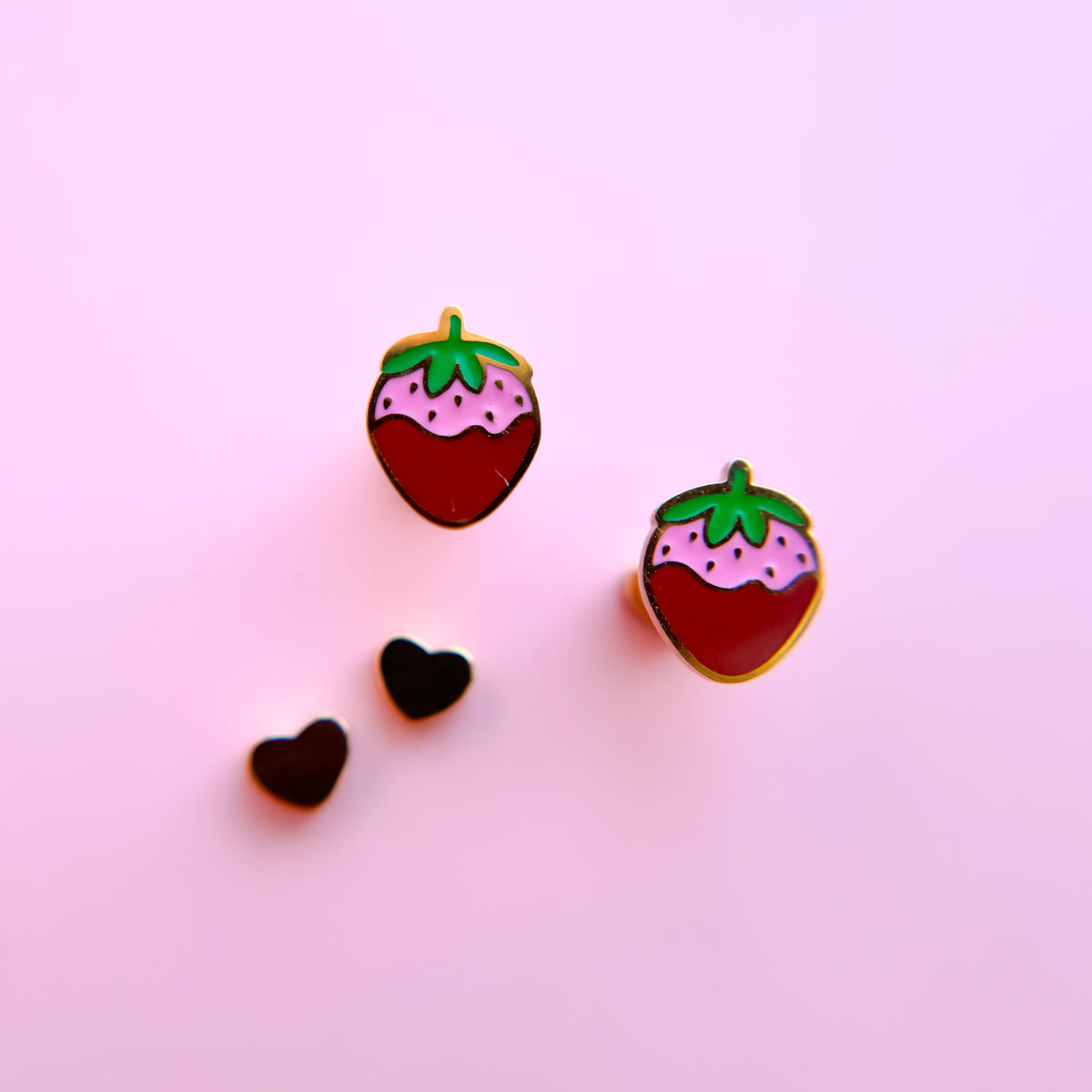 Chocolate covered strawberry stud earrings close-up