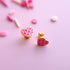 Pair of pink checkered heart stud earrings