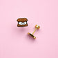 Smores stud earrings on pink background 