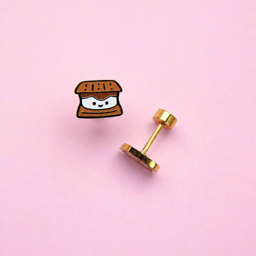 Smores stud earrings on pink background 