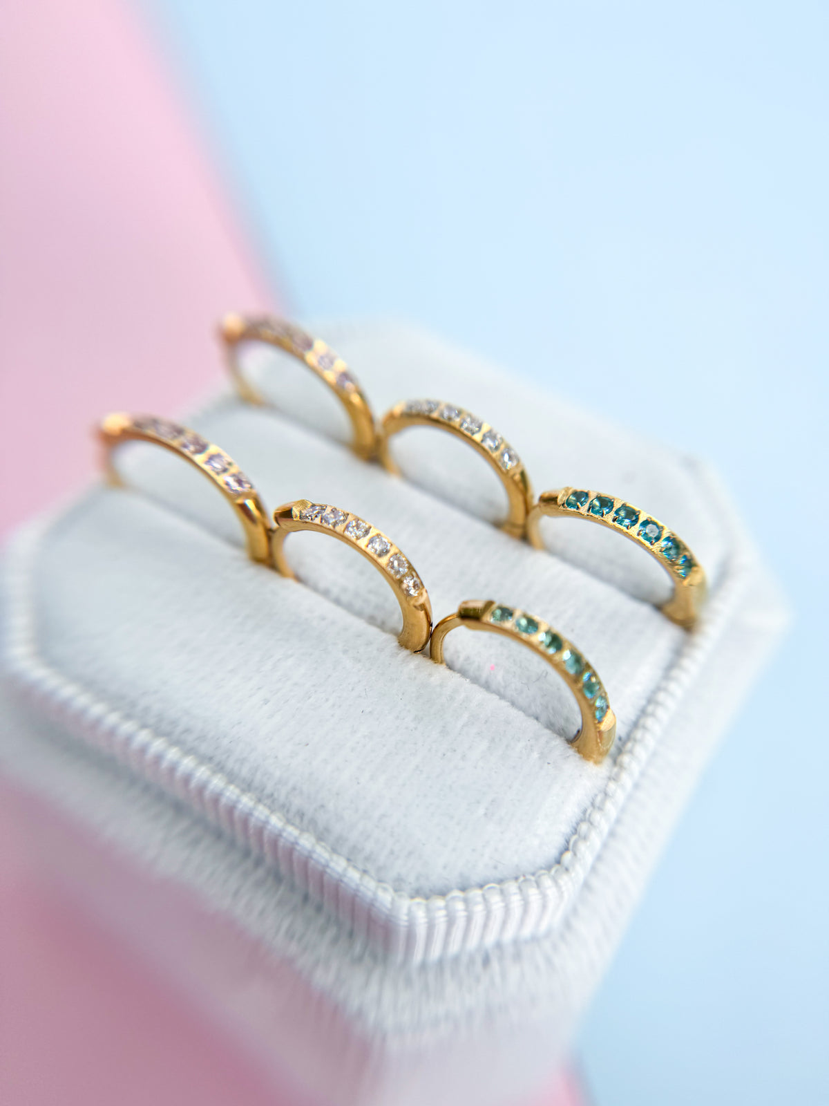 CZ huggie hoop earrings close-up