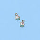Two cupcake-shaped charms on a light blue background
