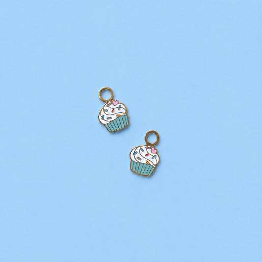 Two cupcake-shaped charms on a light blue background