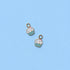 Two cupcake-shaped charms on a light blue background