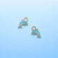 Two dolphin charms on a light blue background