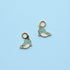 Two blue narwhal-shaped charms on a light blue background