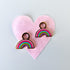 Rainbow huggie charms on huggie hoops