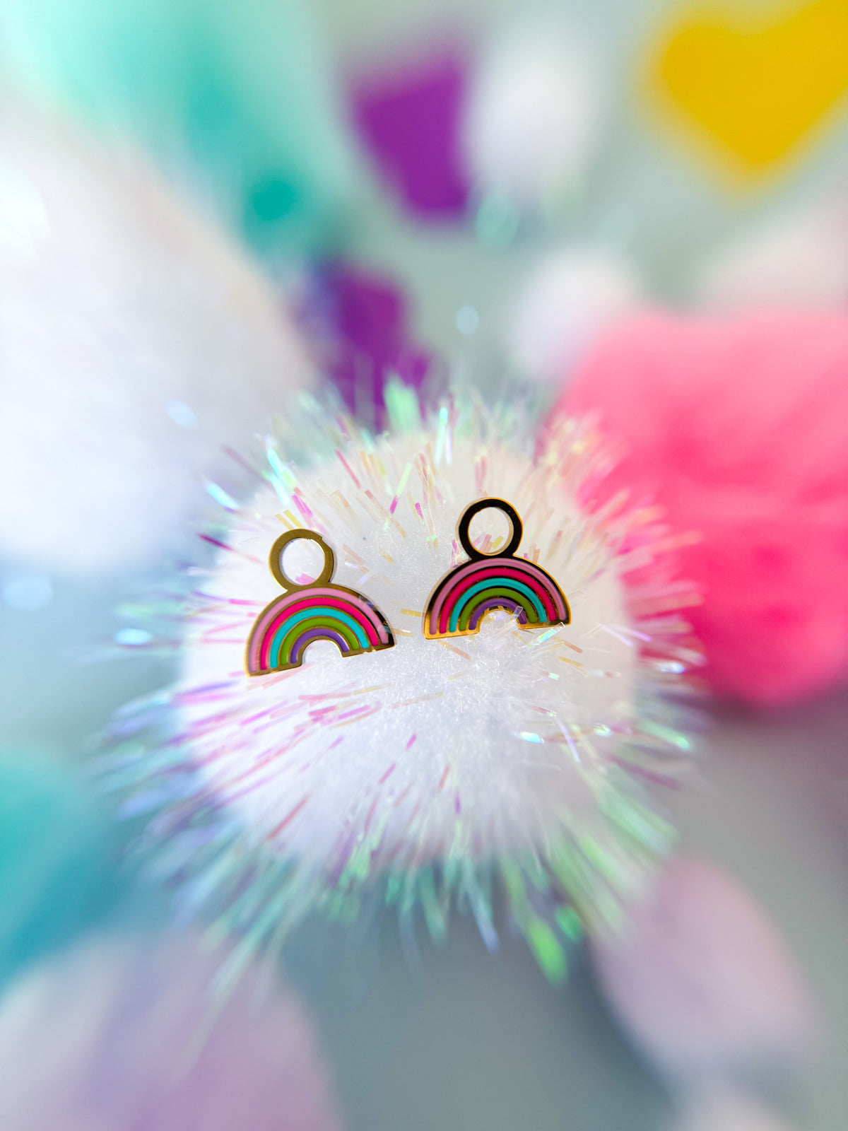 Rainbow huggie charms close-up