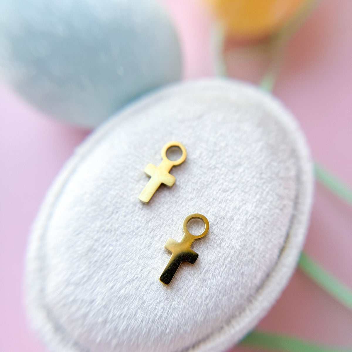 Cross huggie charms on huggie hoops
