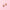 Two small pumpkin-shaped charms with gold-tone loops, pink glittery fill, and yellow jack-o'-lantern faces, arranged on a solid pink background.
