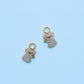 Koala huggie charms on blue background