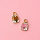 Two milk carton shaped huggie charms on a light pink background. One chocolate, one strawberry