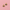 Two small butterfly-shaped jewelry charms with gold-tone metal borders and black enamel detailing, displayed on a solid pink background.