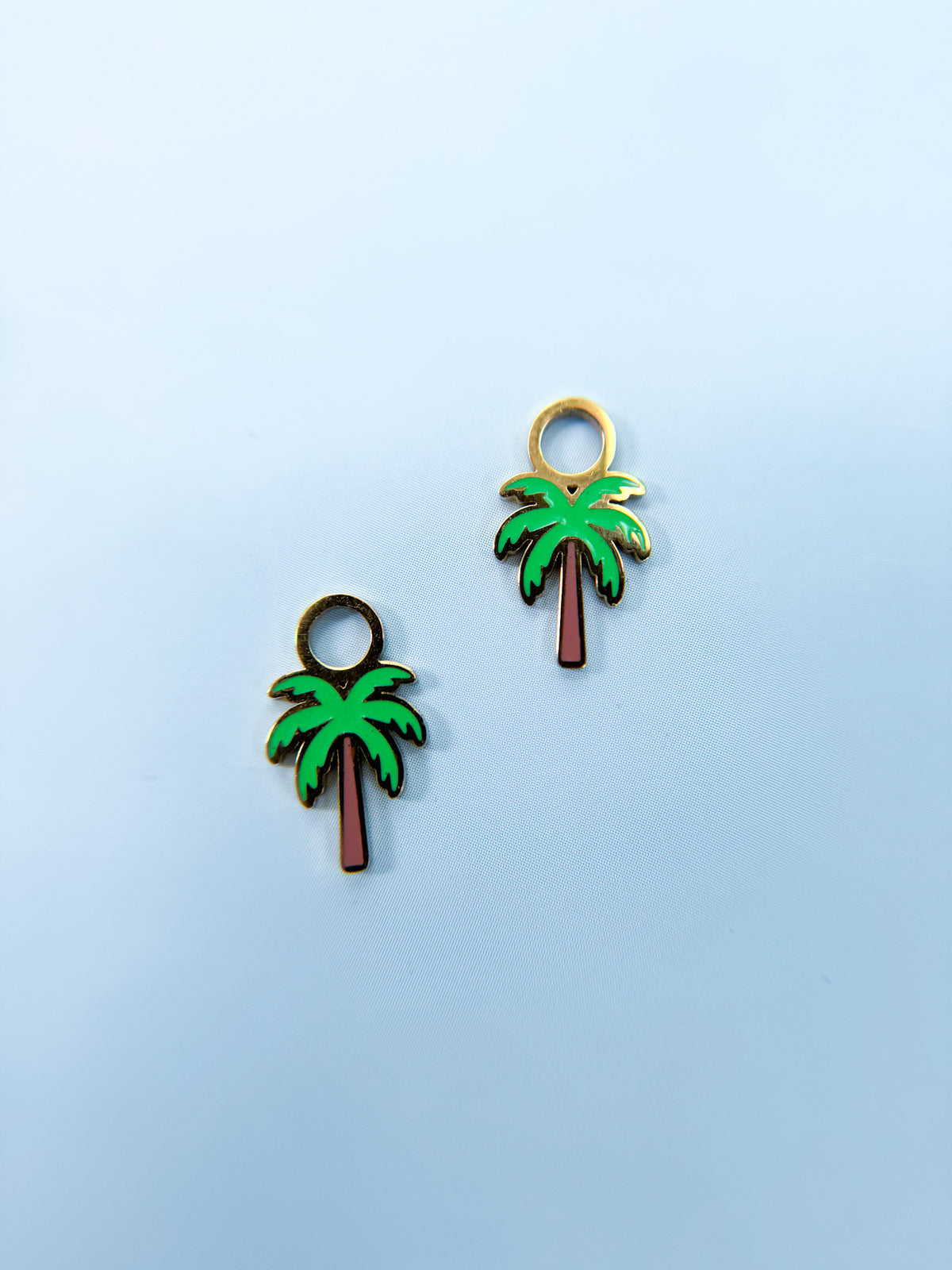 Palm tree huggie charms close-up