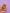 A hand with pink manicured nails holds a small jewelry charm featuring two white hoops, gold-tone metal rings, and two small peanut butter and jelly shaped charms against a solid lavender background.