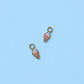 Two ice cream cone charms on a light blue background