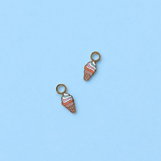 Two ice cream cone charms on a light blue background