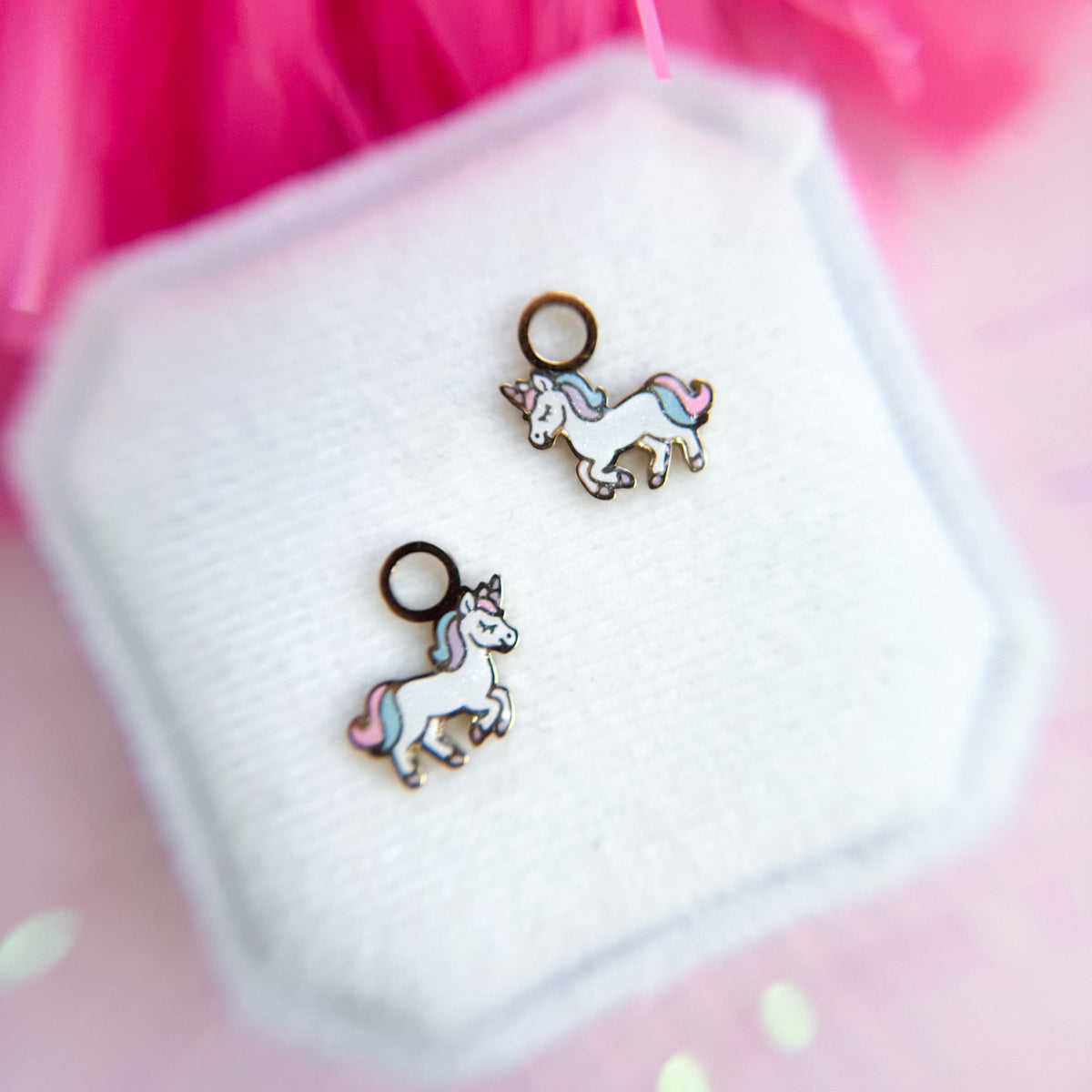 Rainbow unicorn huggie charms on huggie hoops