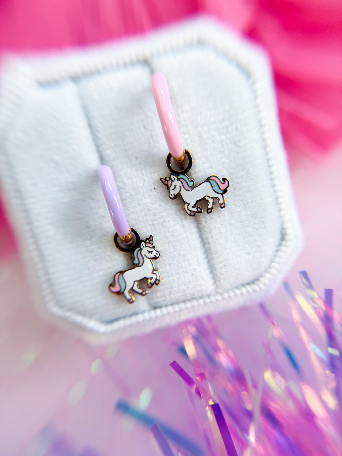 Rainbow unicorn huggie charms close-up