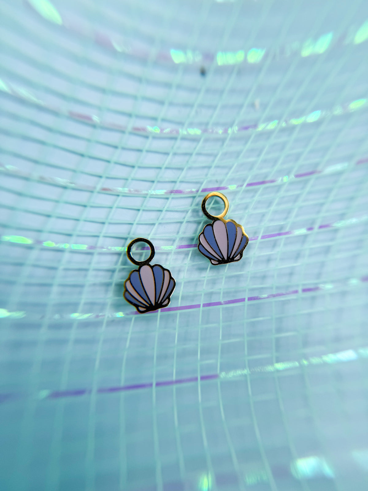 Seashell huggie charms close-up