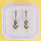 White daisy charms with silver huggie hoops