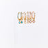 Set of gold hoop earrings with gemstones on a white background