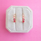 pink heart hoops on a pink background