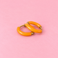 Orange Huggie Hoops
