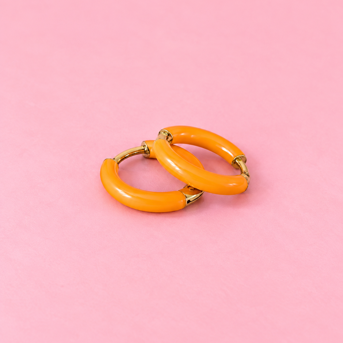 Orange Huggie Hoops