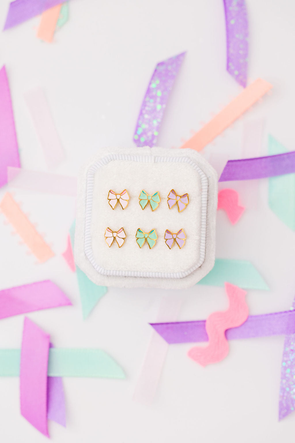 Pink, mint and lavender bow stud earrings together