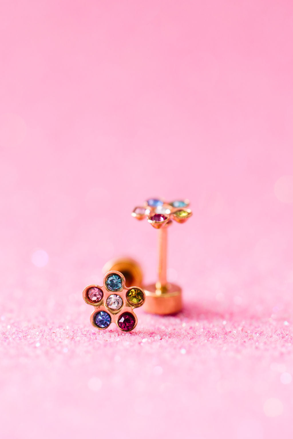 Rainbow CZ flower stud earrings close-up
