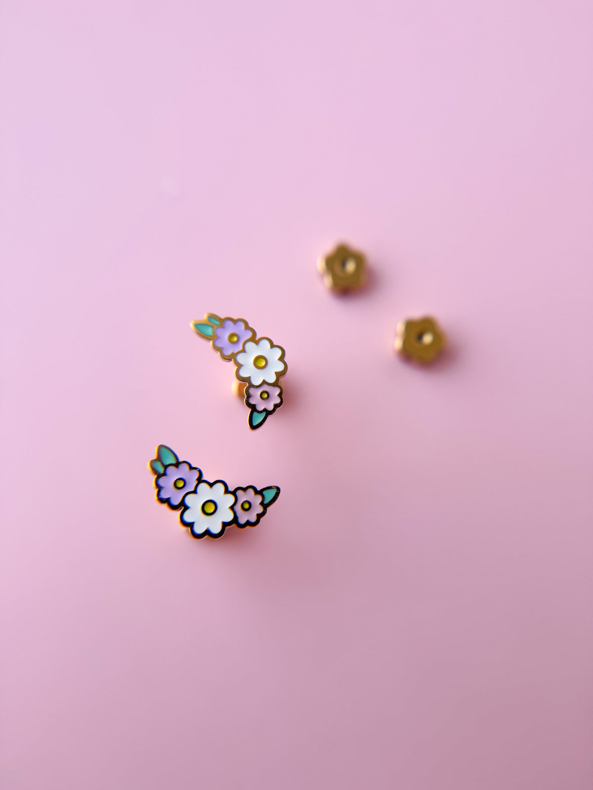 Floral wreath stud earrings close-up