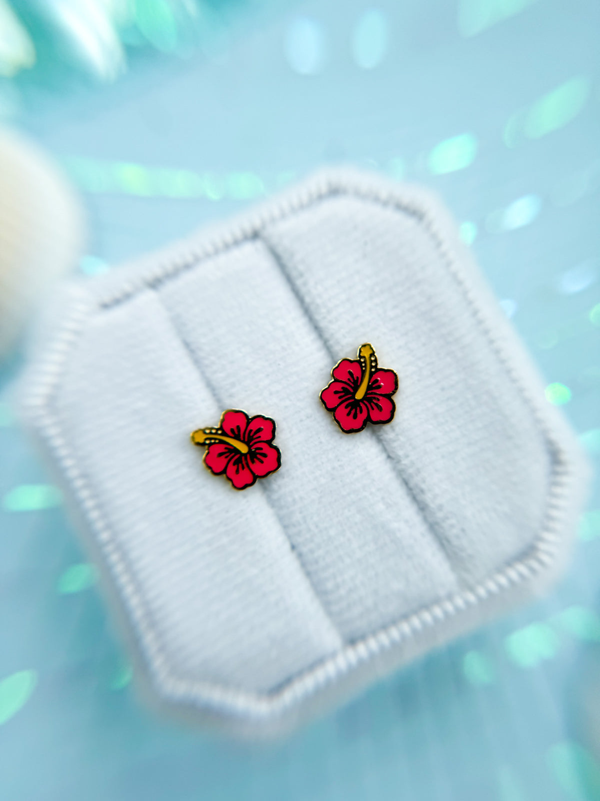 Hibiscus stud earrings close-up