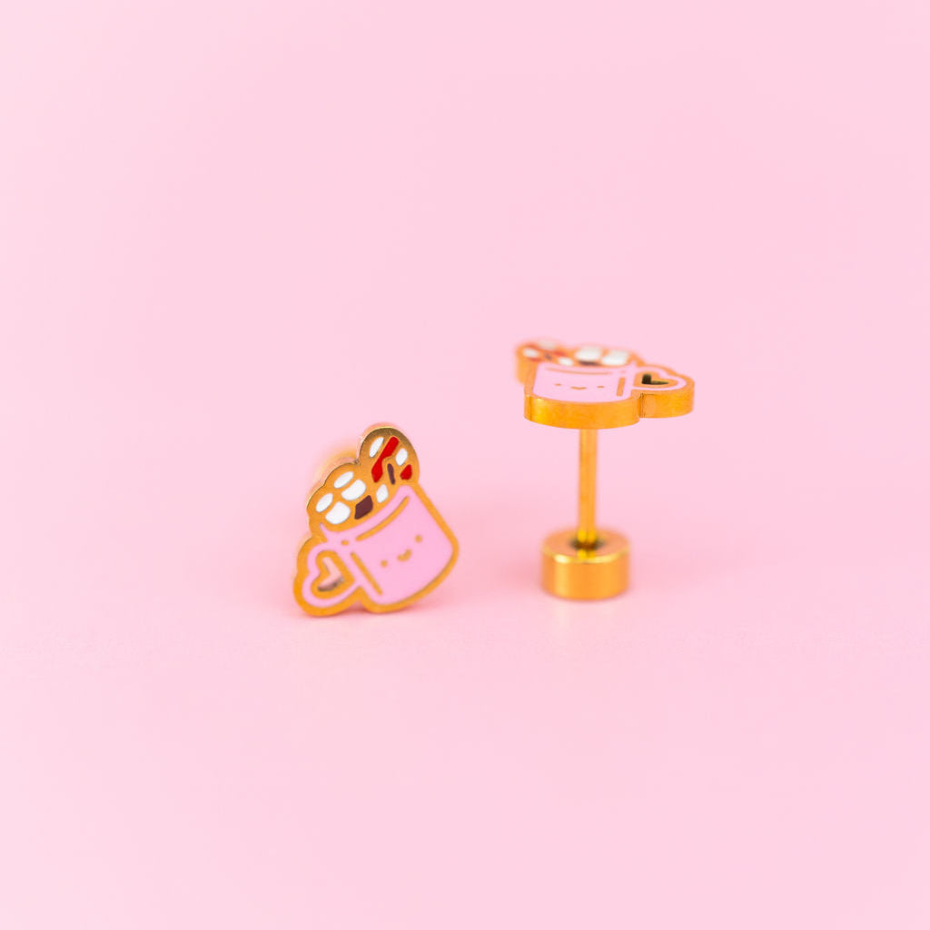 Hot Cocoa Stud Earrings against a light pink background