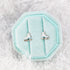 Pair of ice skate stud earrings