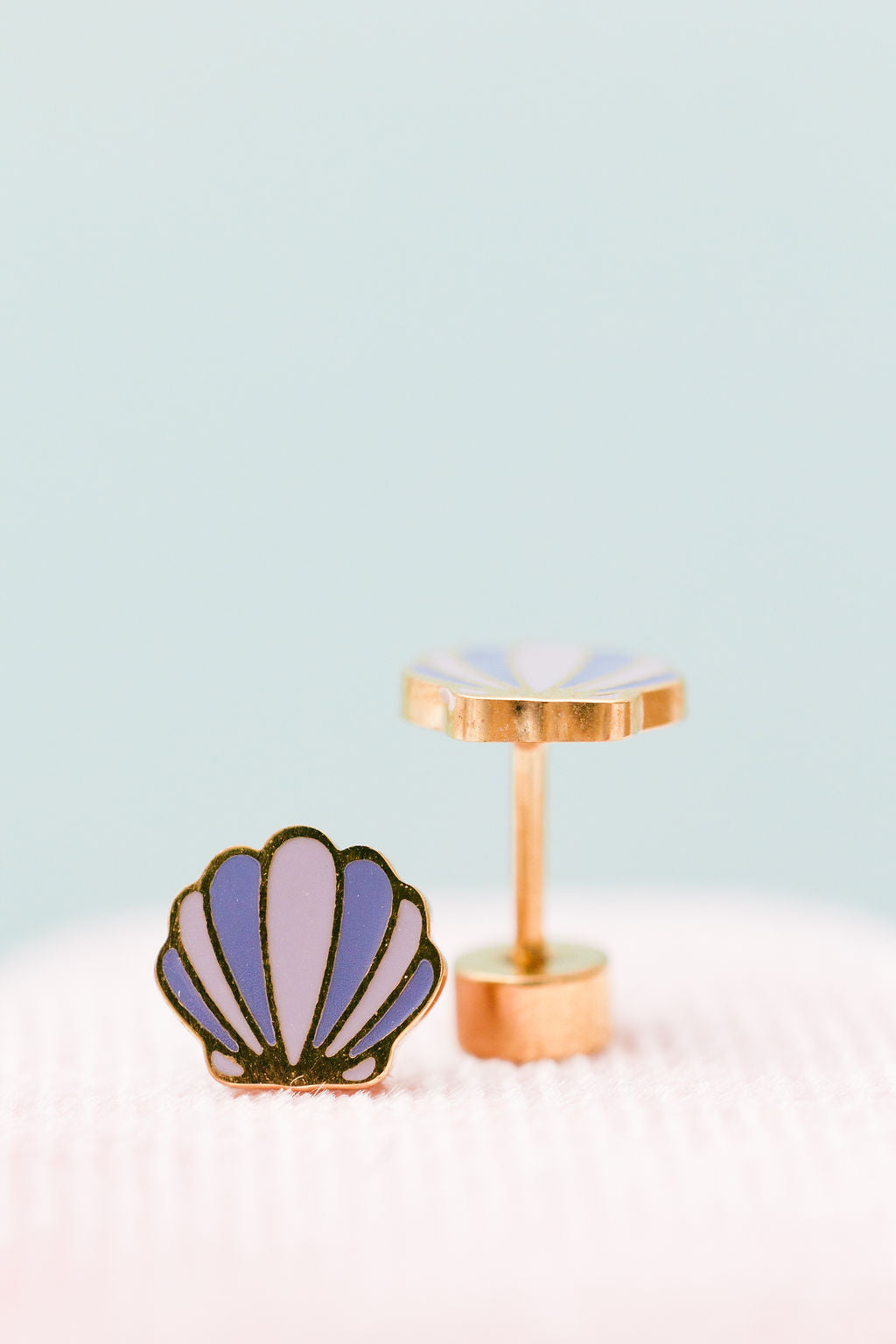 Seashell stud earrings close-up