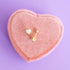 Opalite Heart Stud Earrings with flat backs on a pink heart shaped jewelry box on a lavender background