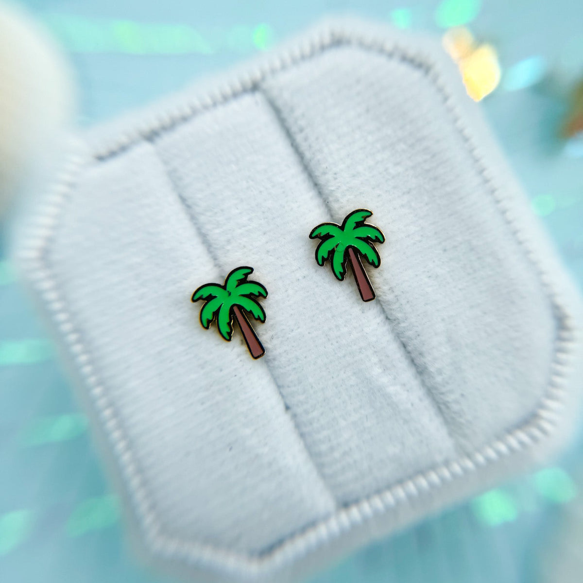 Pair of palm tree stud earrings