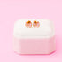 Pair of pink bow stud earrings