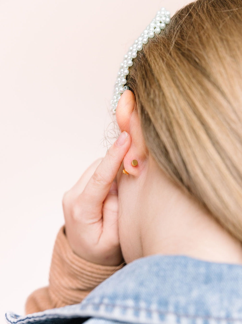 Back of pony stud earrings showing the post and backing
