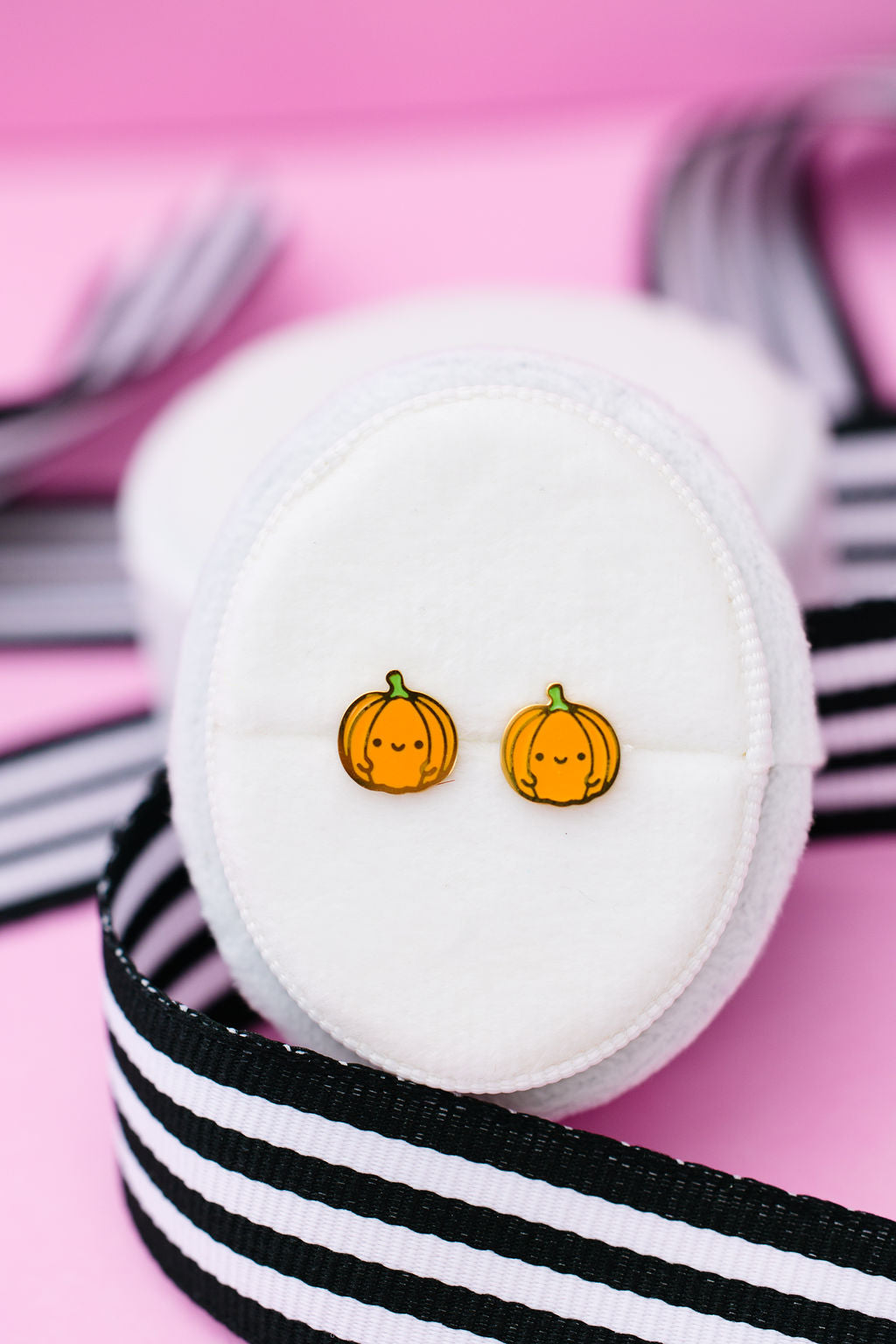Pumpkin stud earrings close-up