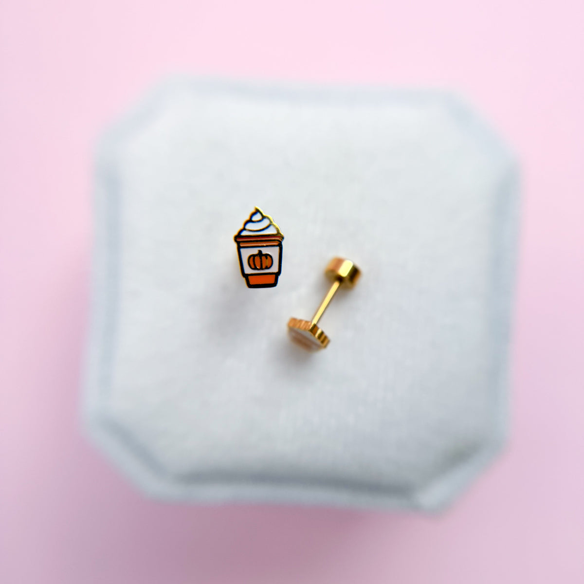 Pumpkin Spice Latte shaped flat back earrings on a white jewelry box with a pink background