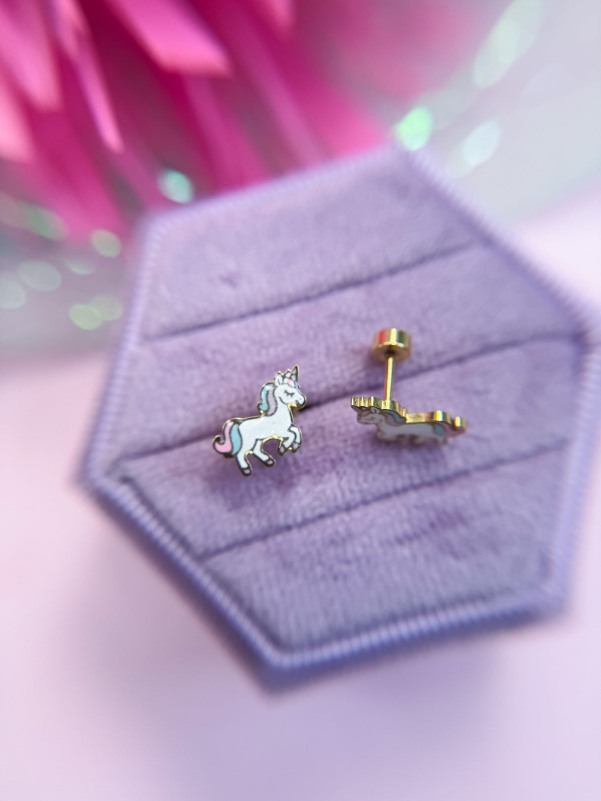 Rainbow unicorn stud earrings close-up