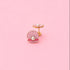 Earrings with a pink shell and pearl on a pink background