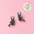 Skeleton kitty stud earrings glowing in the dark