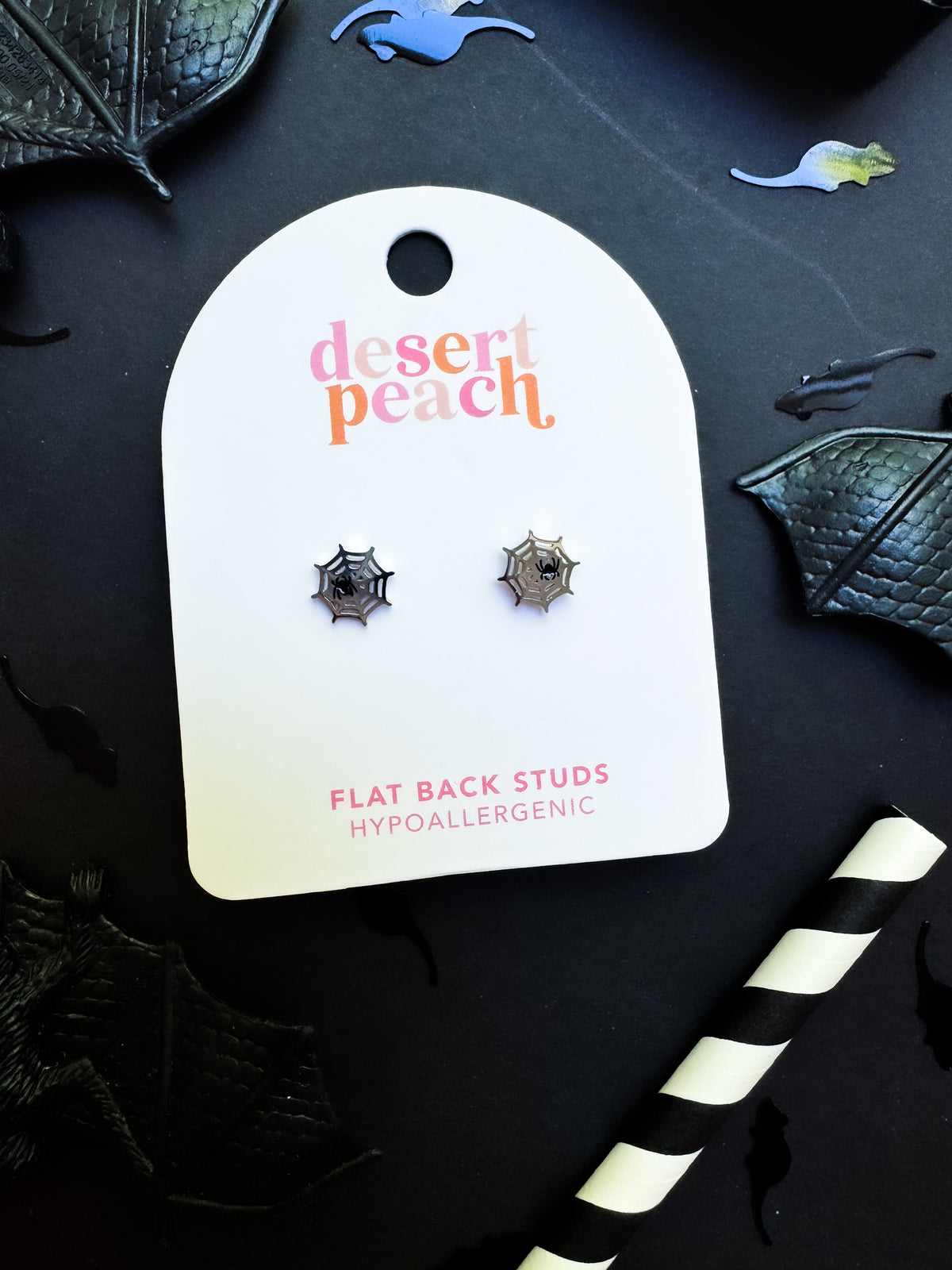 Spiderweb stud earrings close-up